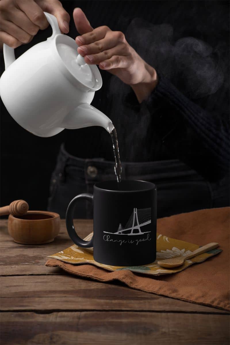 11 oz Motivational Mug with a girl pouring boiling water into her cup of tea