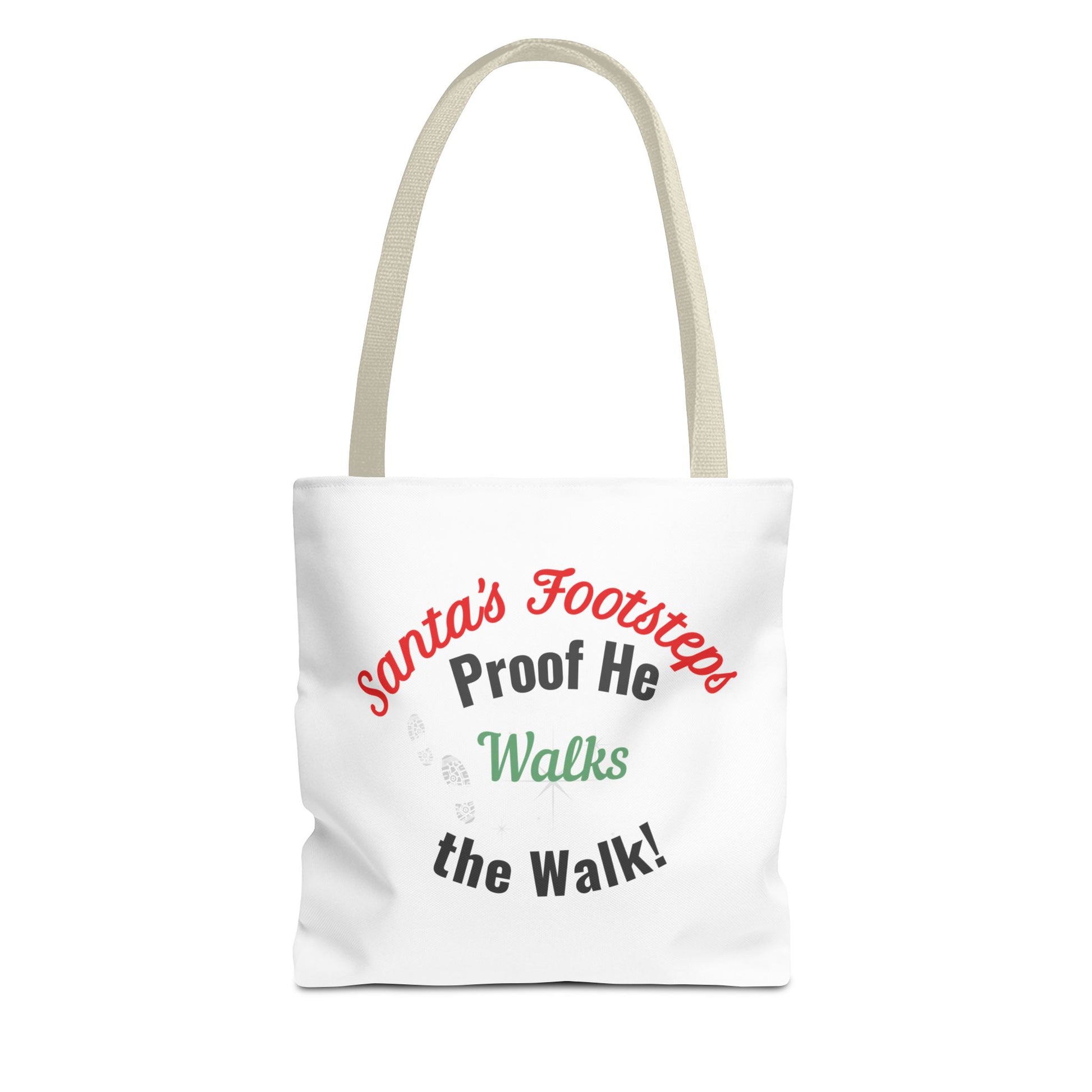 White tote bag with beige handle featuring humorous text 'Santa's Footsteps - Proof He Walks The Walk!' on a white background