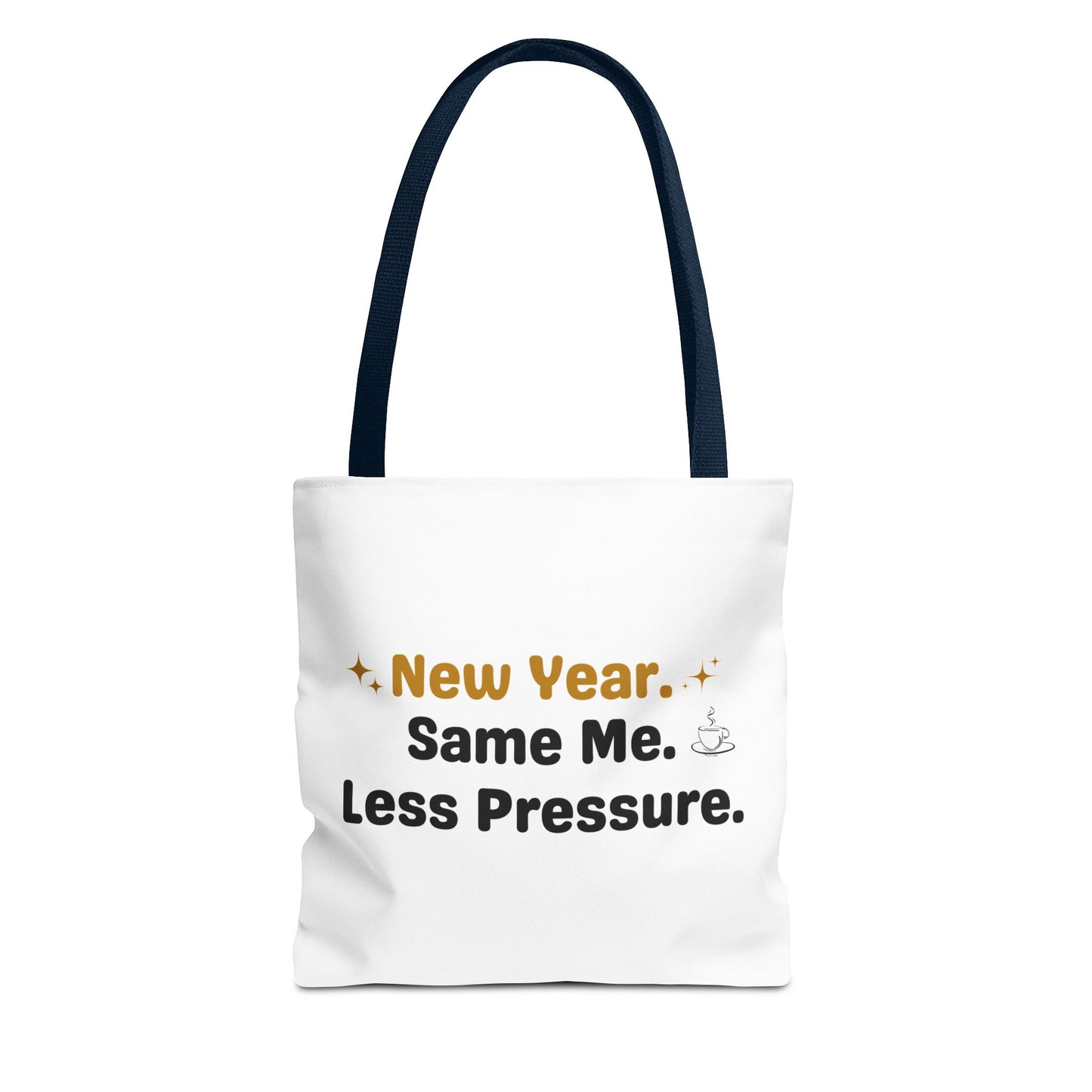 White tote bag with navy handle and text 'New Year. Same Me. Less Pressure.' and handle on a white background