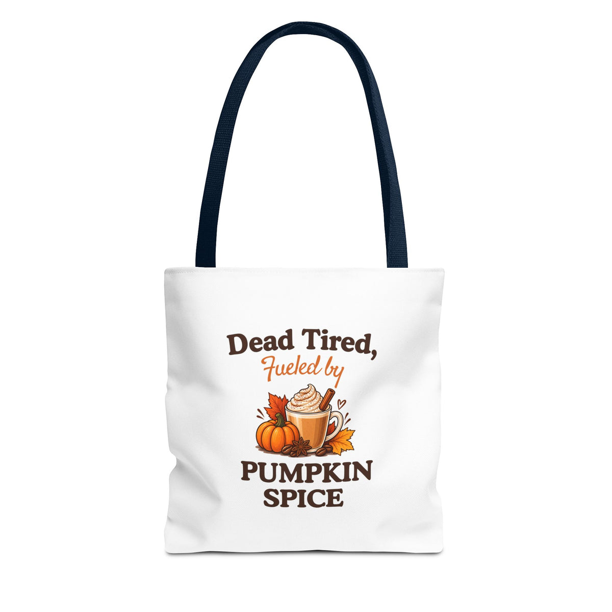 A white canvas tote bag with navy shoulder straps, featuring a printed autumn-themed graphic that reads 'Dead Tired, Fueled by Pumpkin Spice'