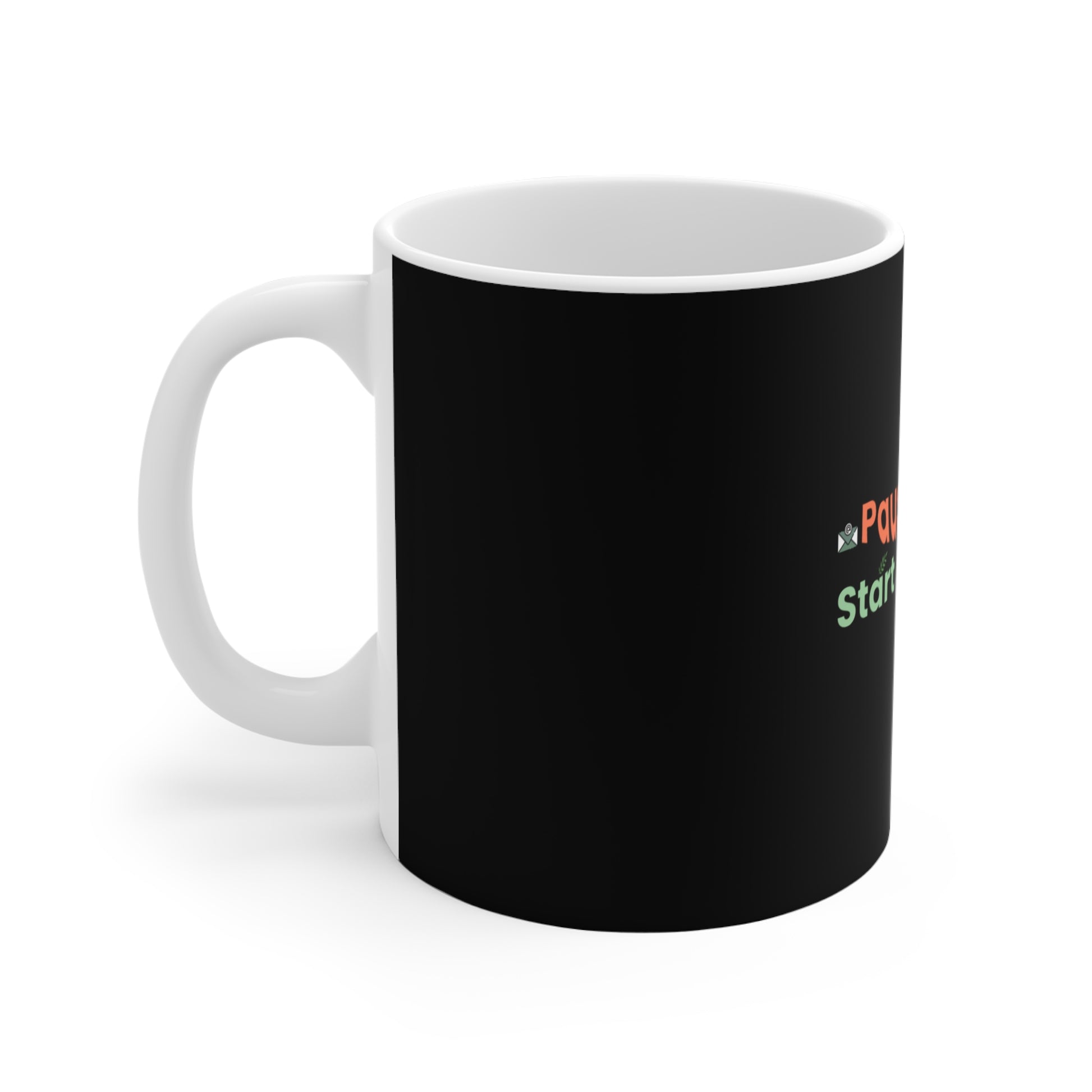 Black mug with text "Pause emails, Start Breathing" and handle on a white background
