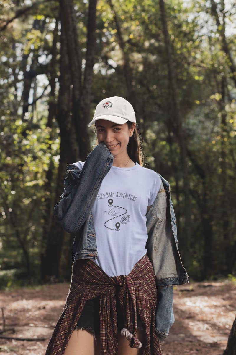 2025 Baby Adventure T-Shirt with a girl posing in the woods