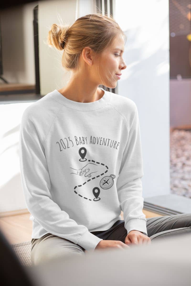 2025 Baby adventure sweatshirt with the girl sitting looking out the window
