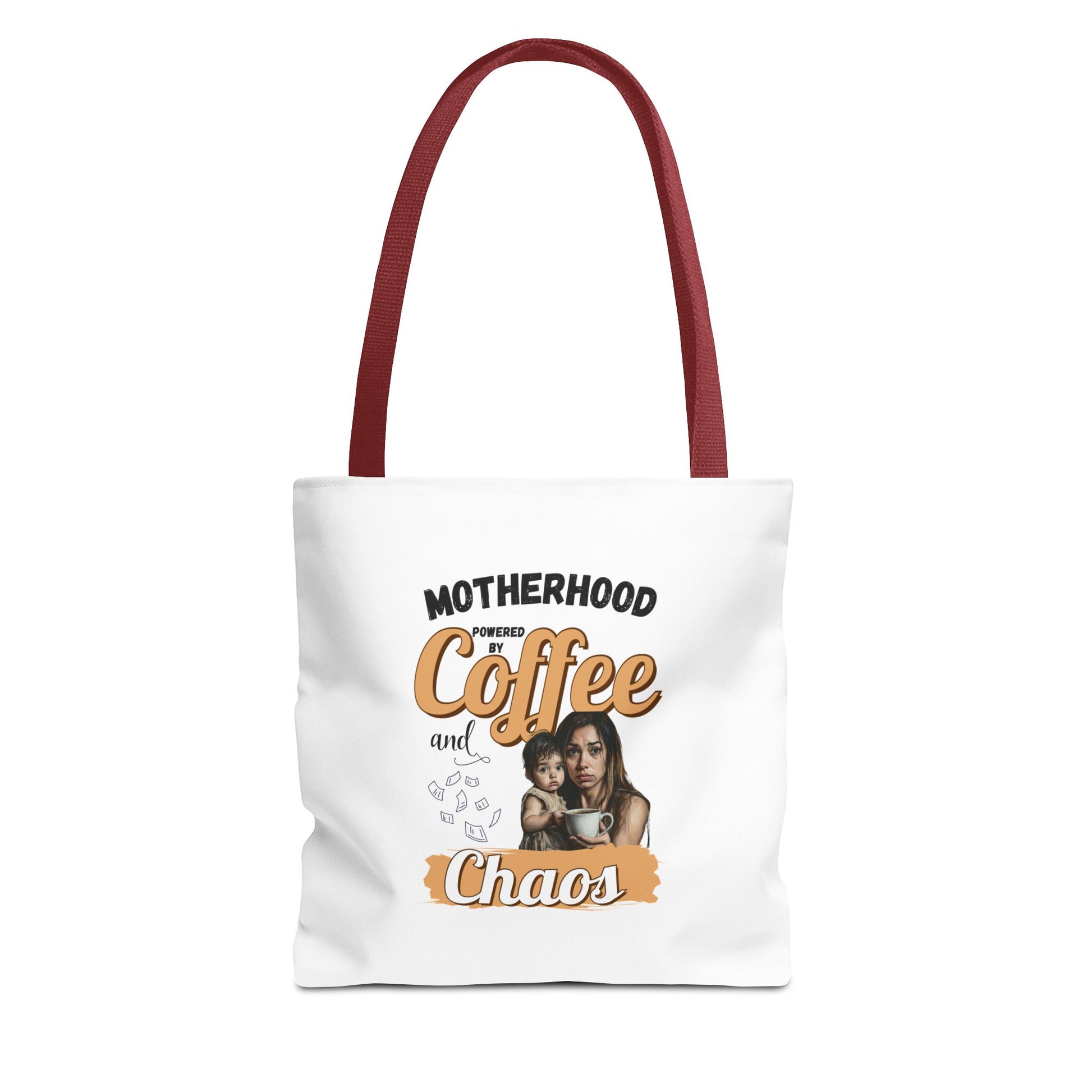 Tote bag with red handle and 'Motherhood powered by Coffee and Chaos' text on a white background