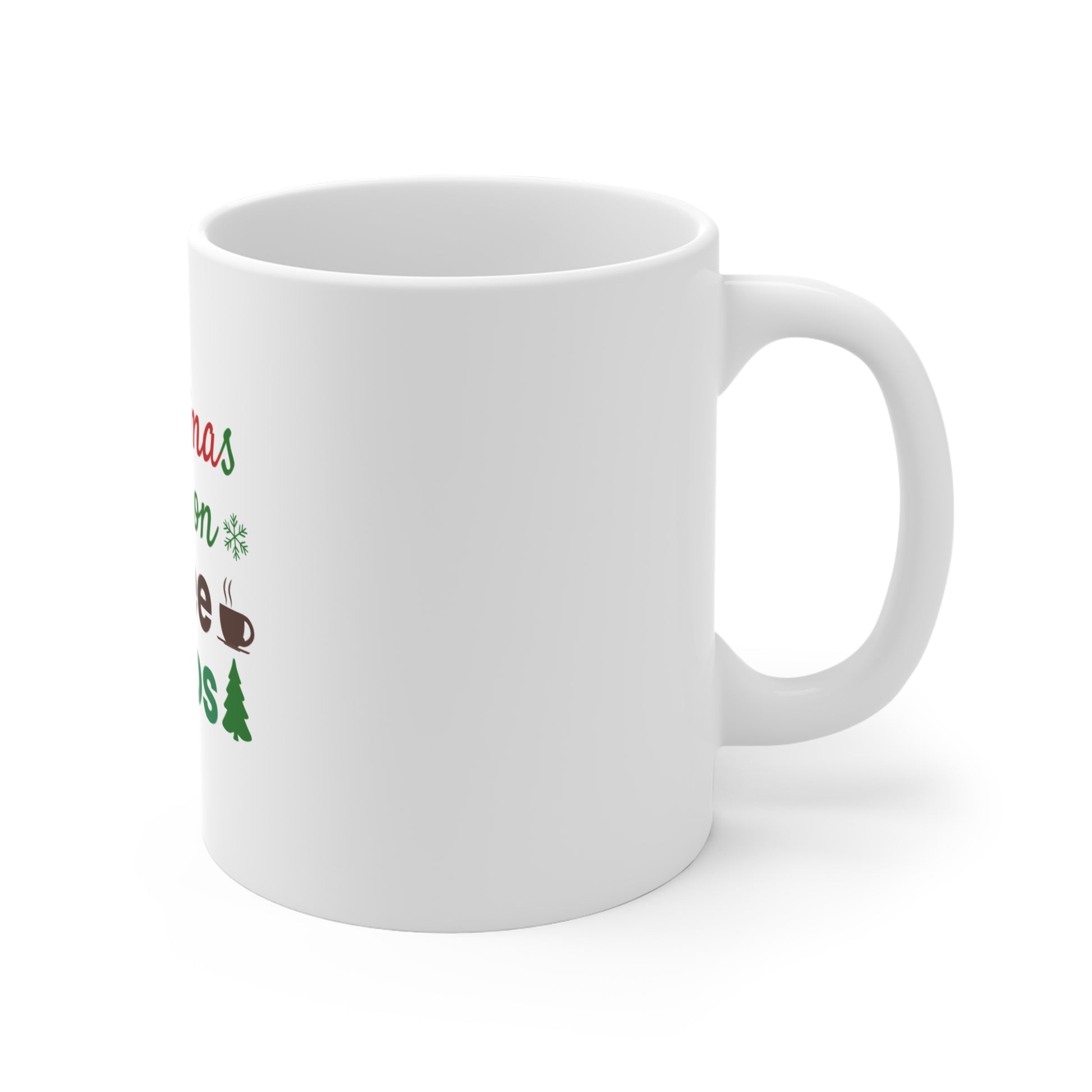Right side view of white mug with Christmas-themed text and graphics on a white background