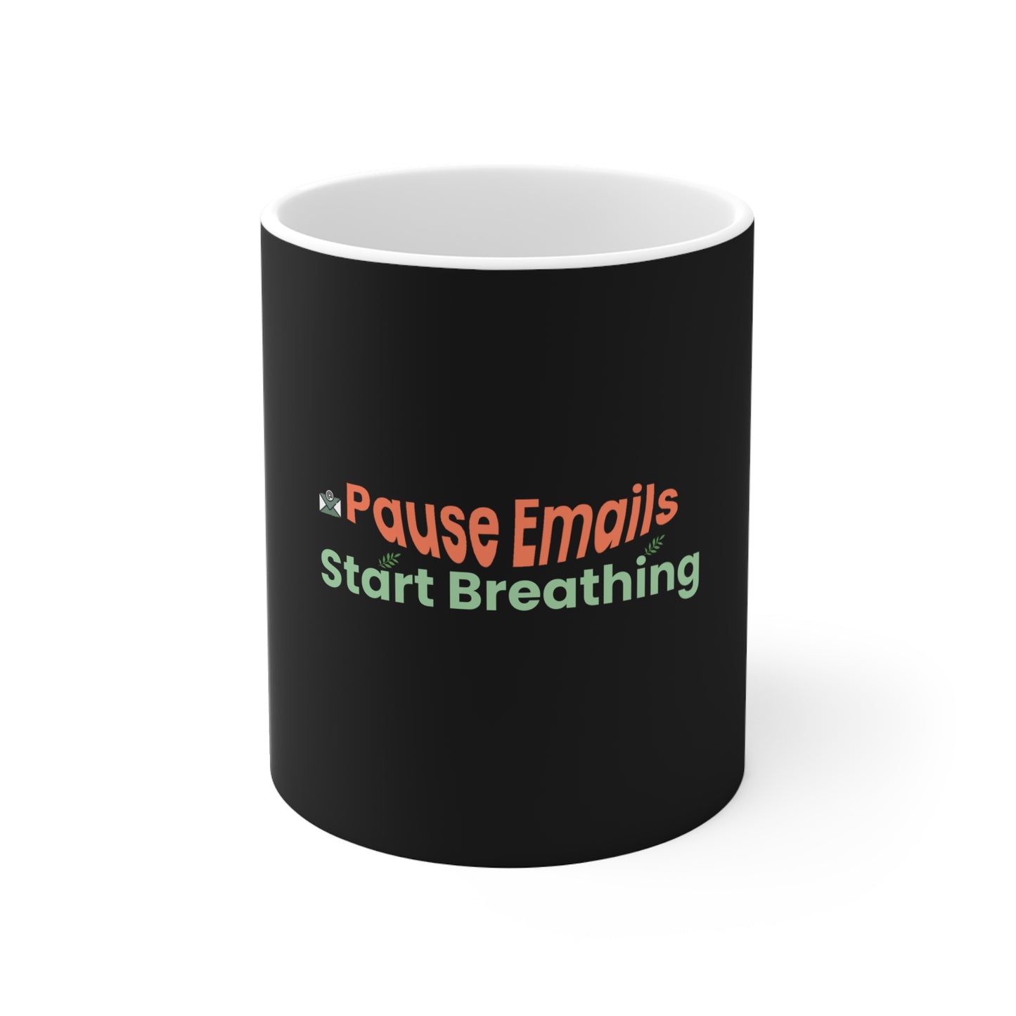 Black mug with colorful text 'Pause Emails Start Breathing' on a white background