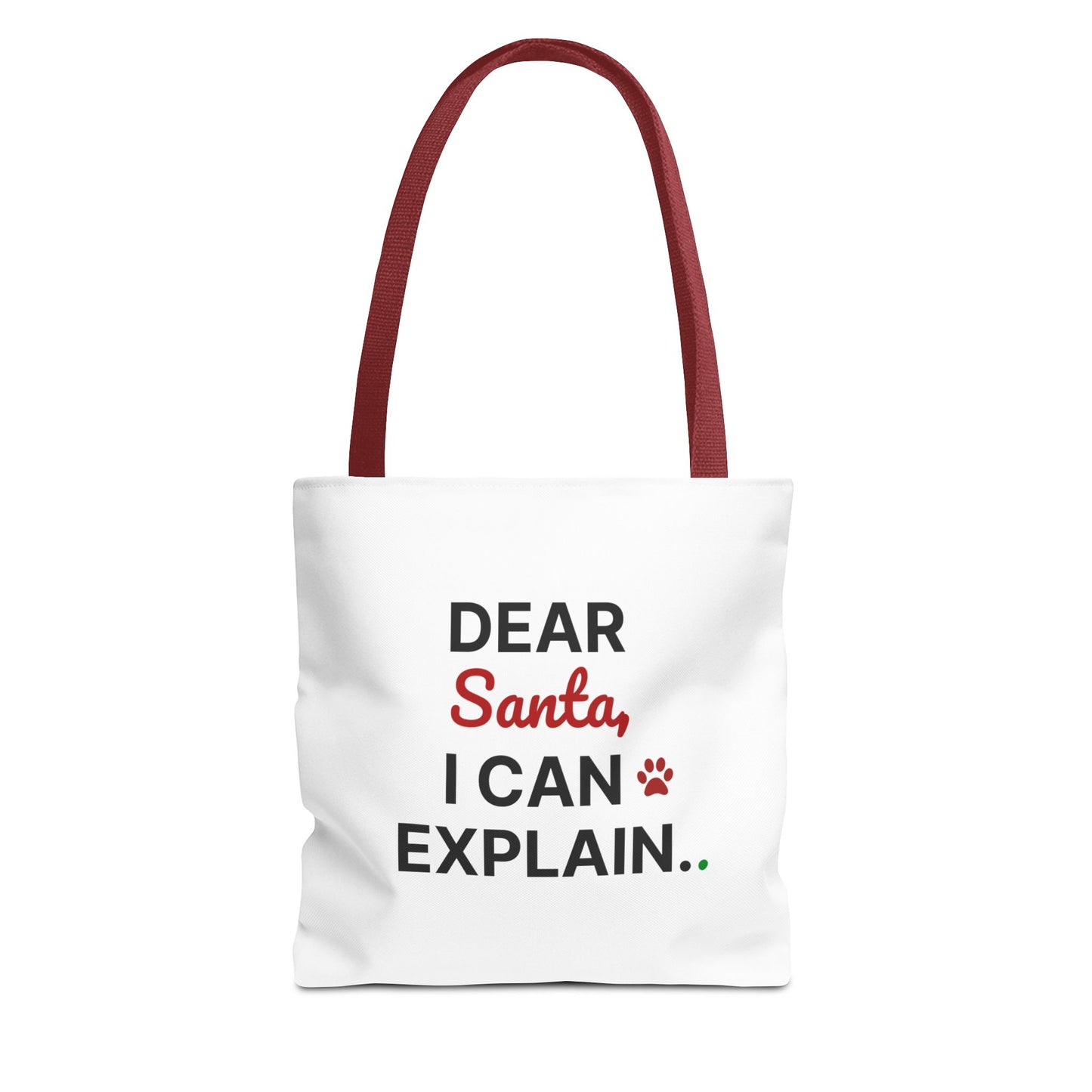 Tote bag with red handle and 'Dear Santa, I can explain' text on a white background