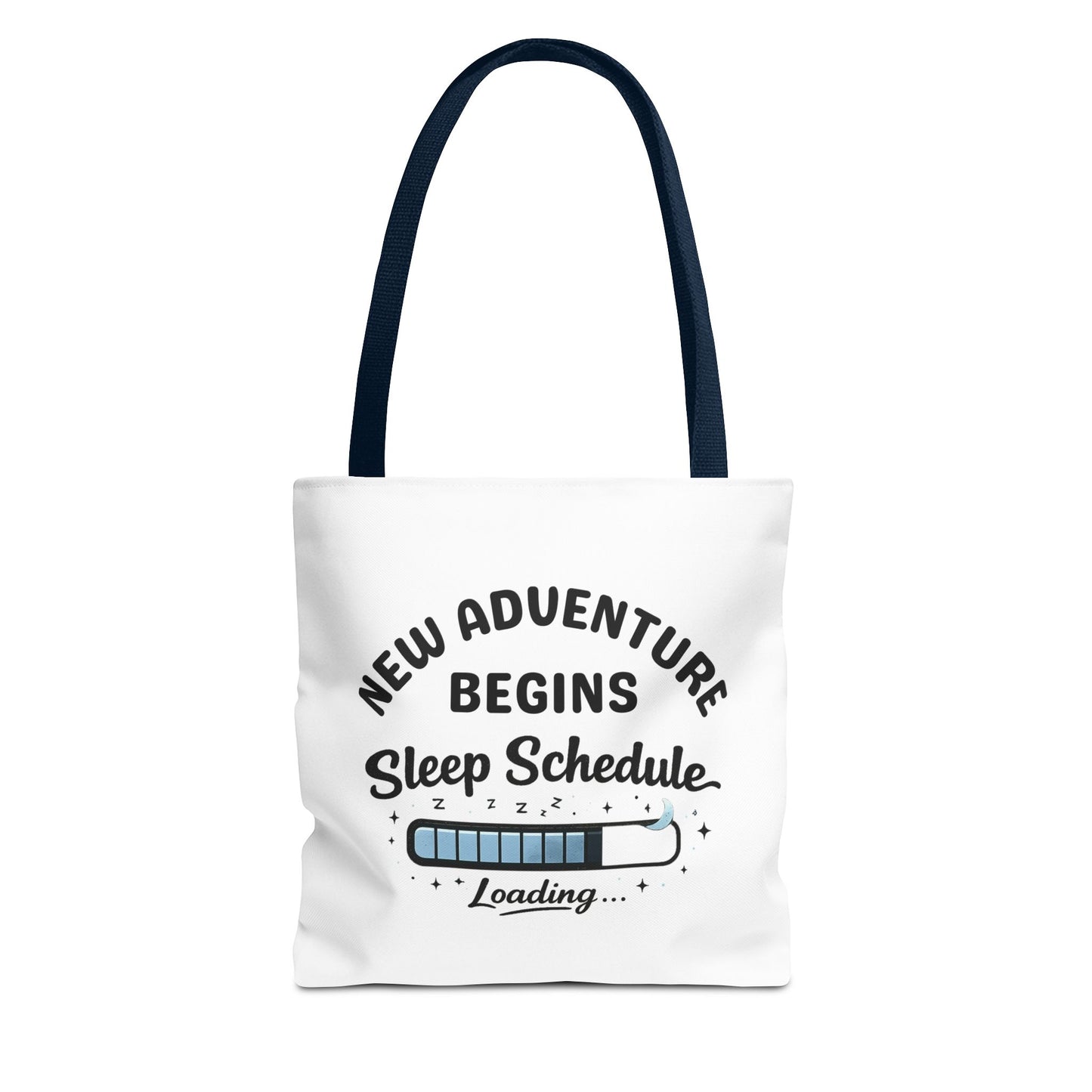 Tote bag with navy handle and 'New Adventure Begins Sleep Schedule Loading' text on a white background