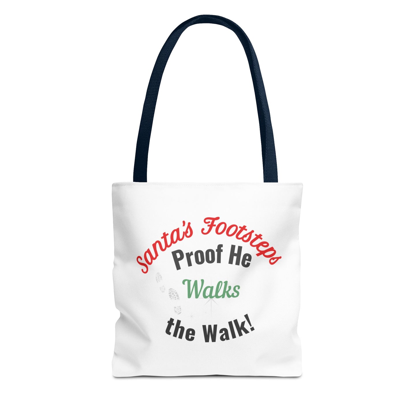 White tote bag with navy handle featuring humorous text 'Santa's Footsteps - Proof He Walks The Walk!' on a white background