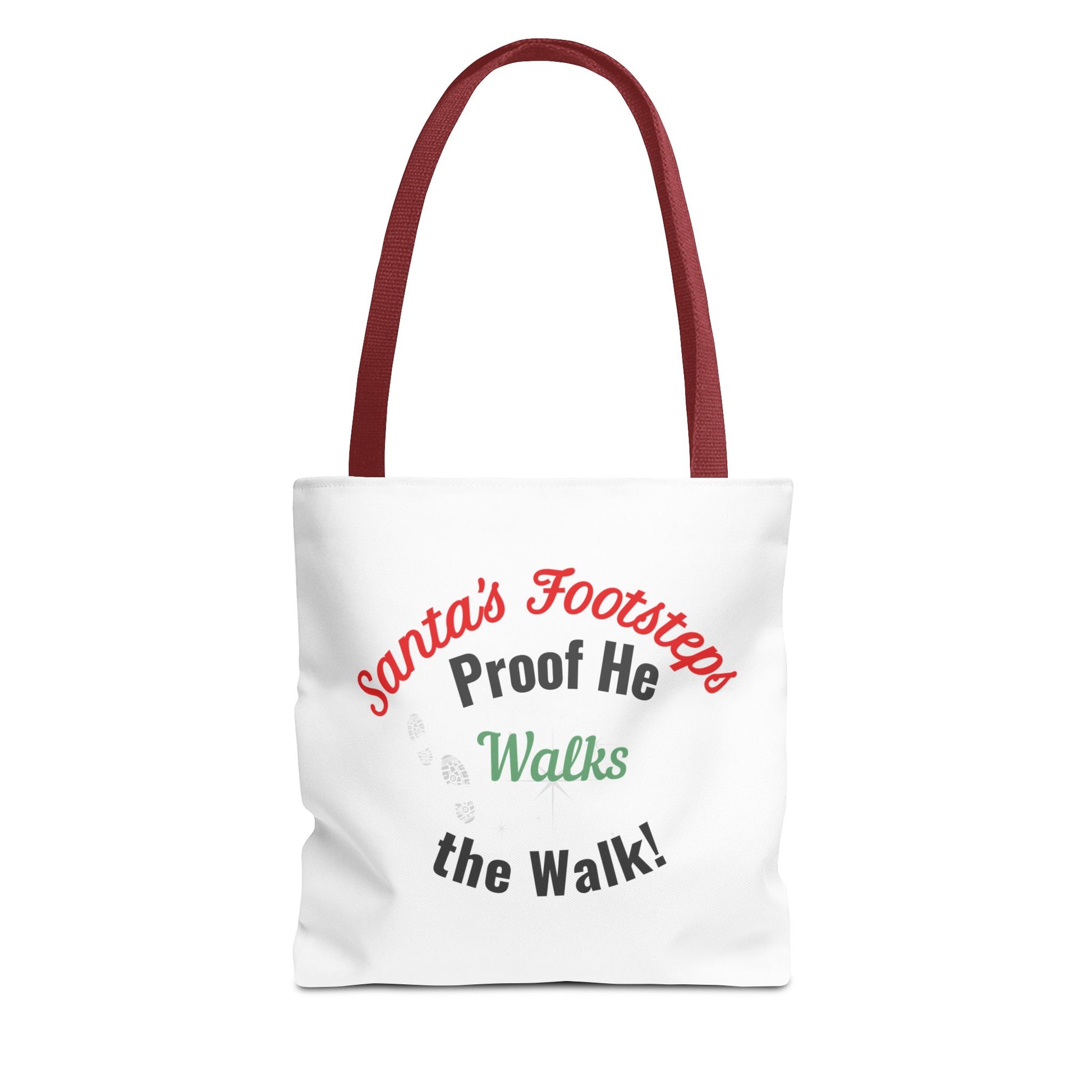 White tote bag with red handle featuring humorous text 'Santa's Footsteps - Proof He Walks The Walk!' on a white background