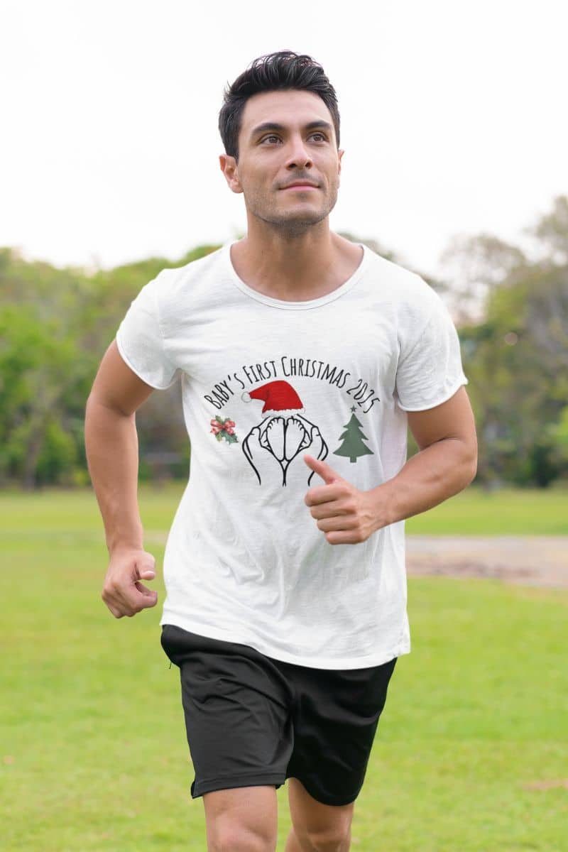 Baby's First Christmas 2025 T-Shirt with a man jogging in the park