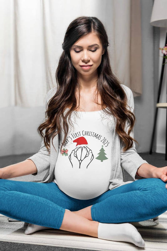 Baby's First Christmas 2025 T-Shirt with a pregnant woman meditating