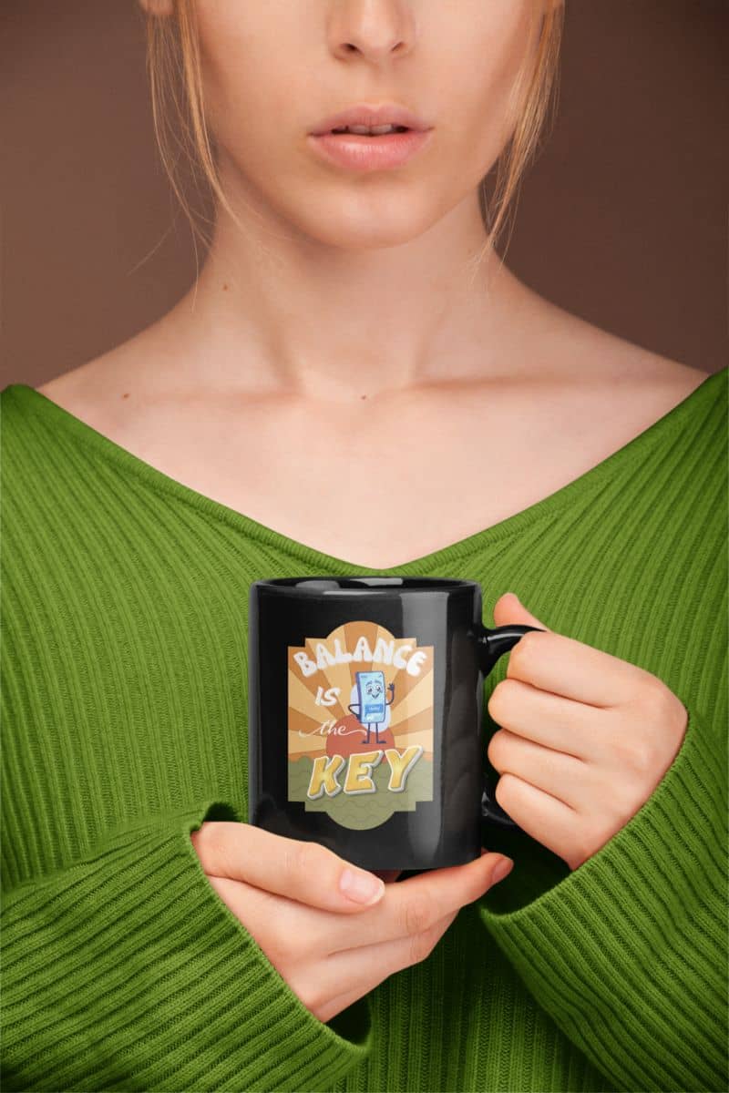 Balance is the key mug with a girl holding a cup of coffee in front of her