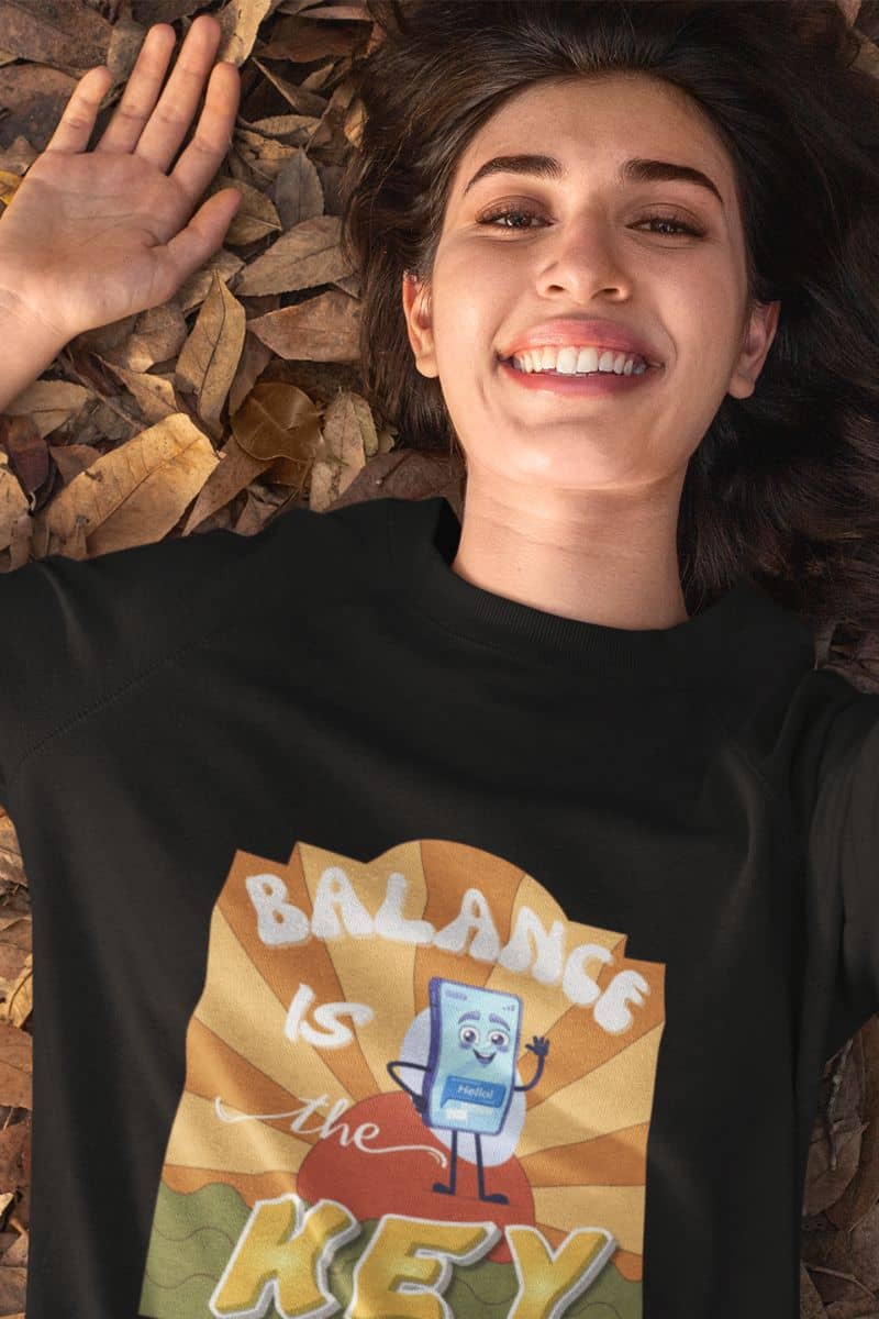 Balance is the key sweatshirt with a girl lying on fallen leaves in autumn