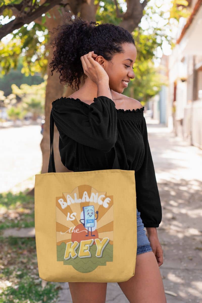 Balance is the key tote bag with a young girl posing under a tree with a tote bag and shorts