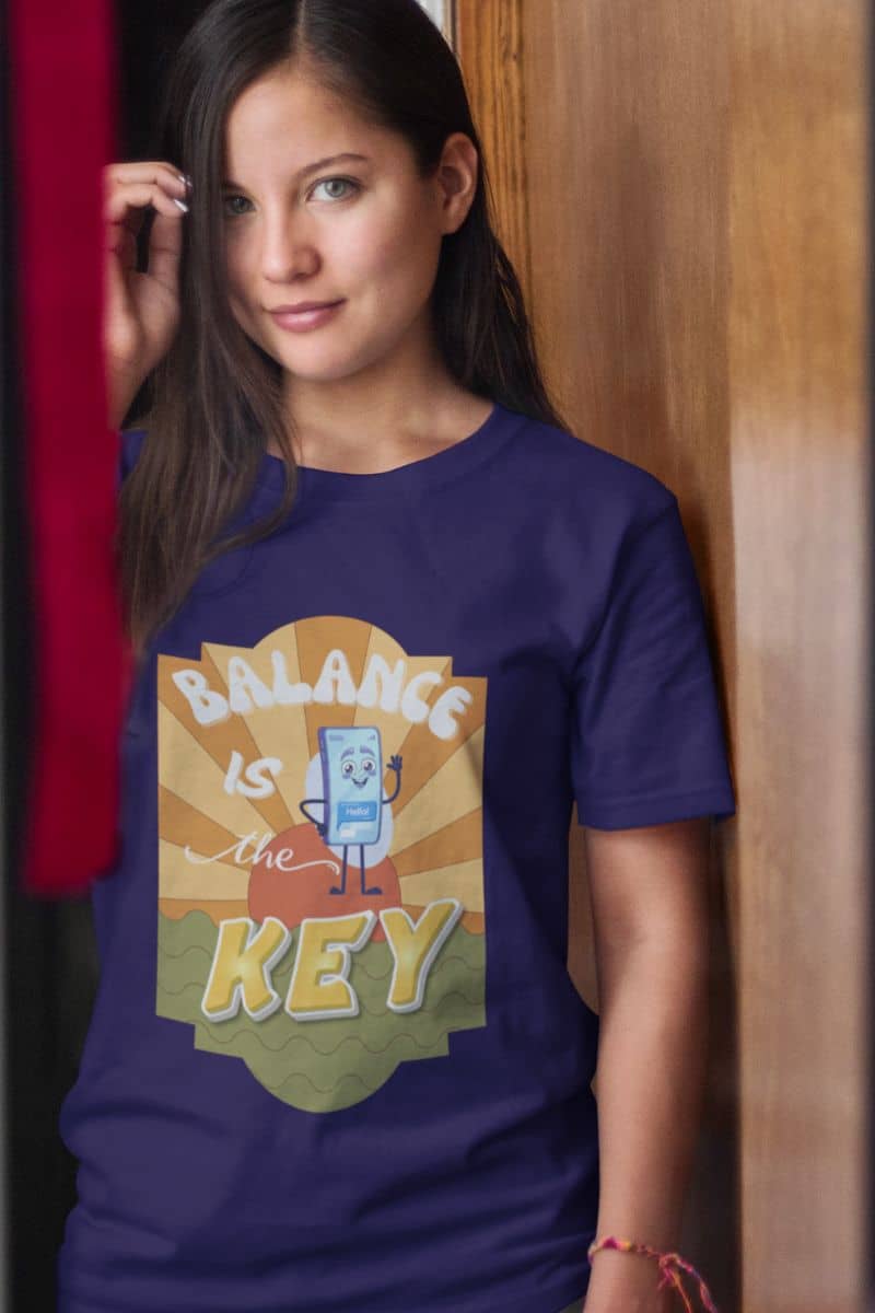 Balance is the key t-shirt with a girl standing shyly by the door