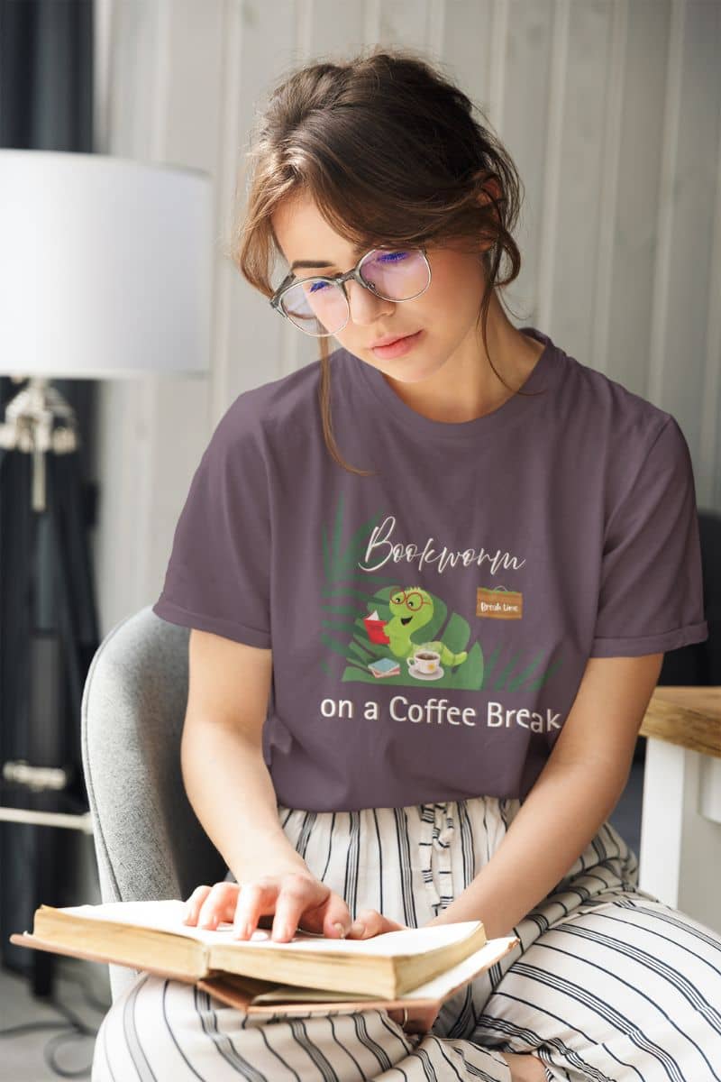 Bookworm coffee break t-shirt with a girl sitting on a chair reading a book