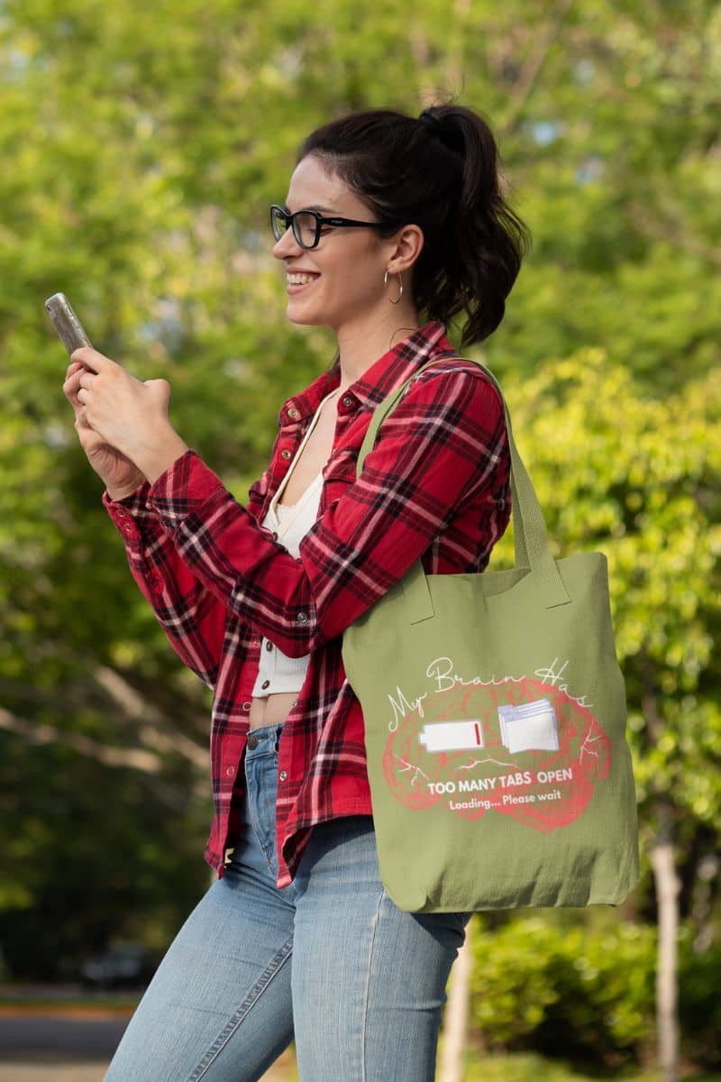 Brain overload tote bag with the girl smiling and texting on the phone