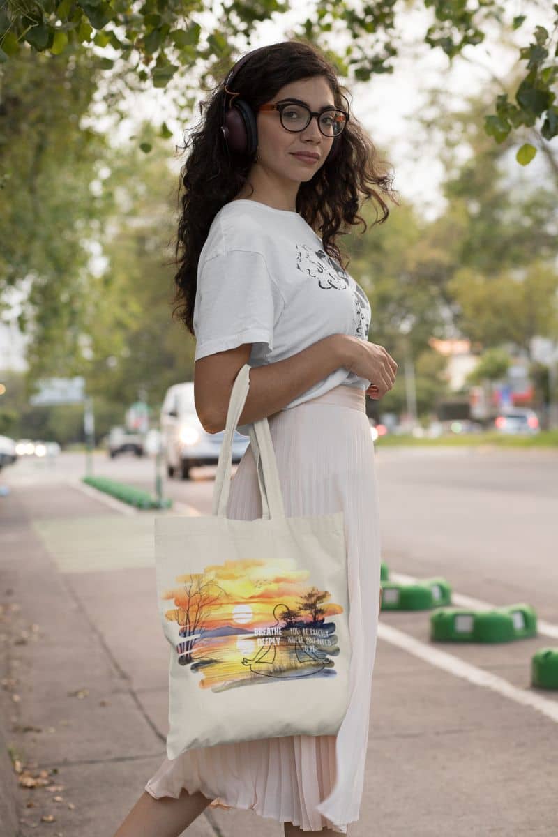 Breathe Deeply Tote Bag with a girl posing on the side of the road