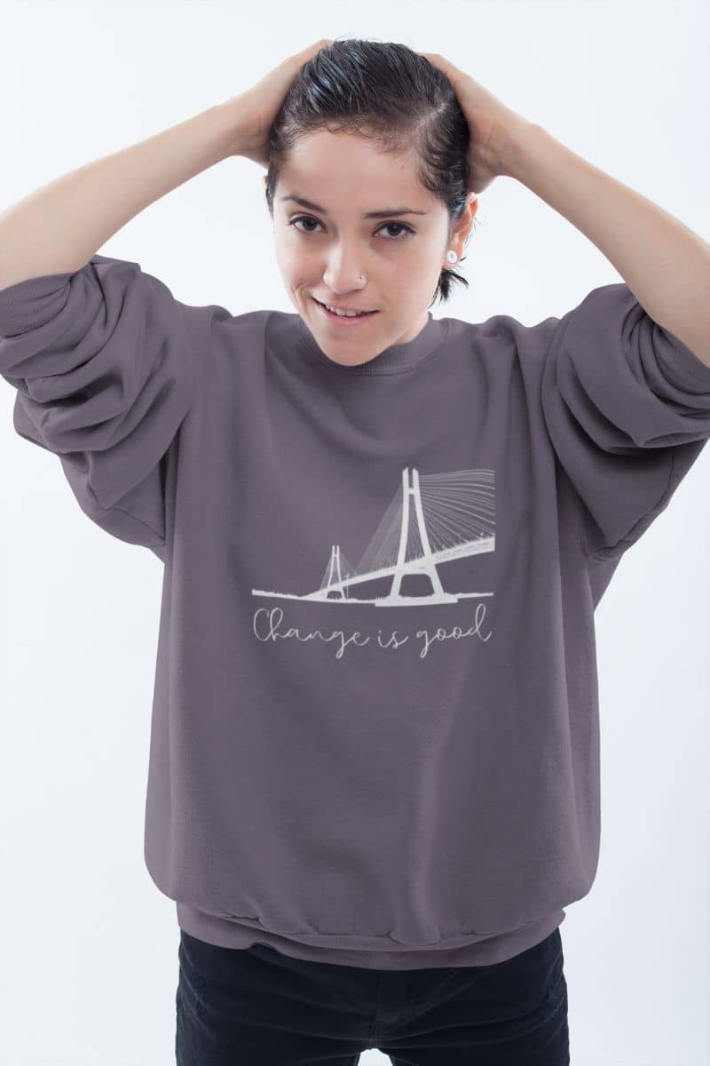 Change is good sweatshirt with a short-haired girl standing and posing by brushing her hair back