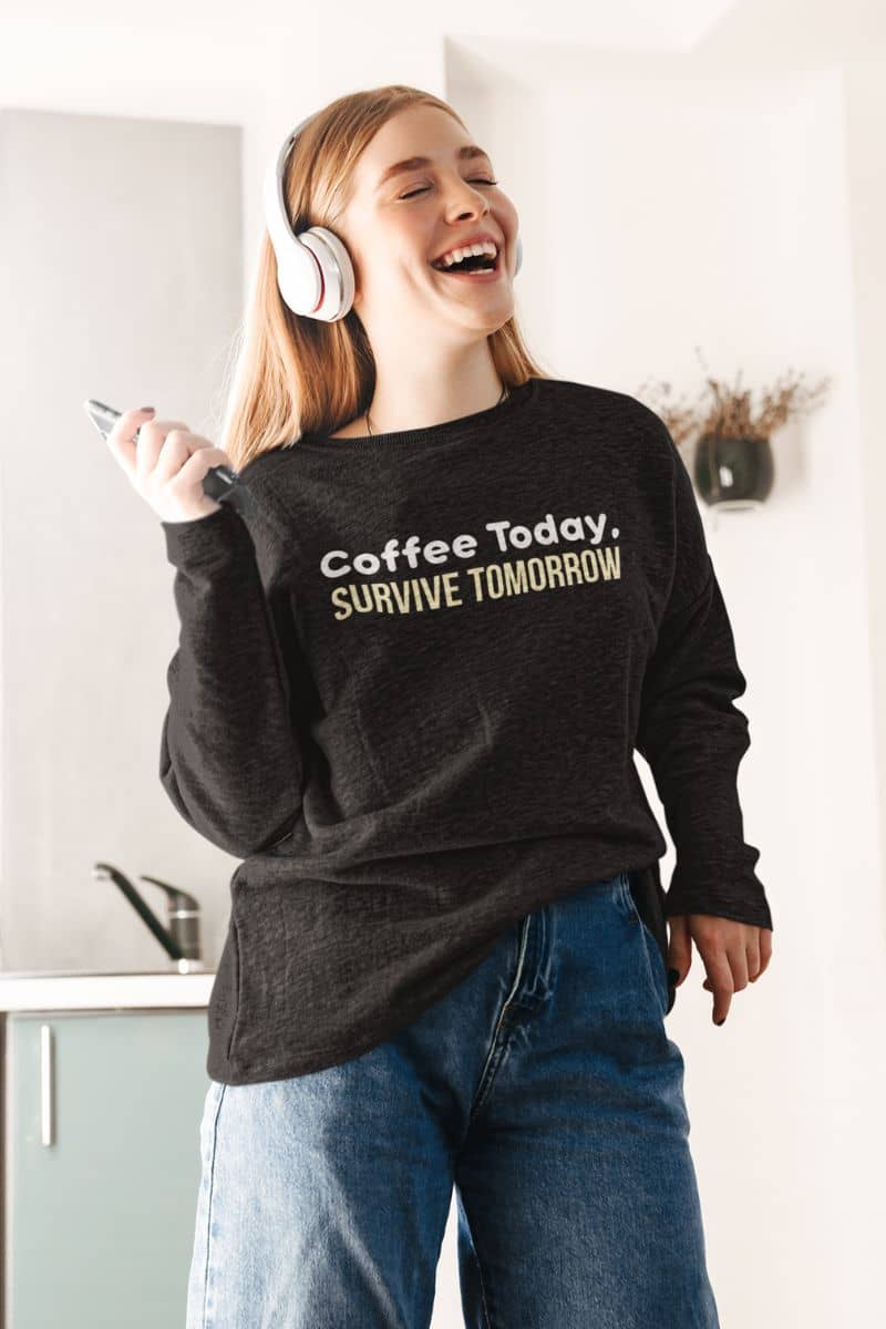 Coffee lover cozy sweater with a beautiful girl in a black sweatshirt with the text 'Coffee Today, Survive Tomorrow'