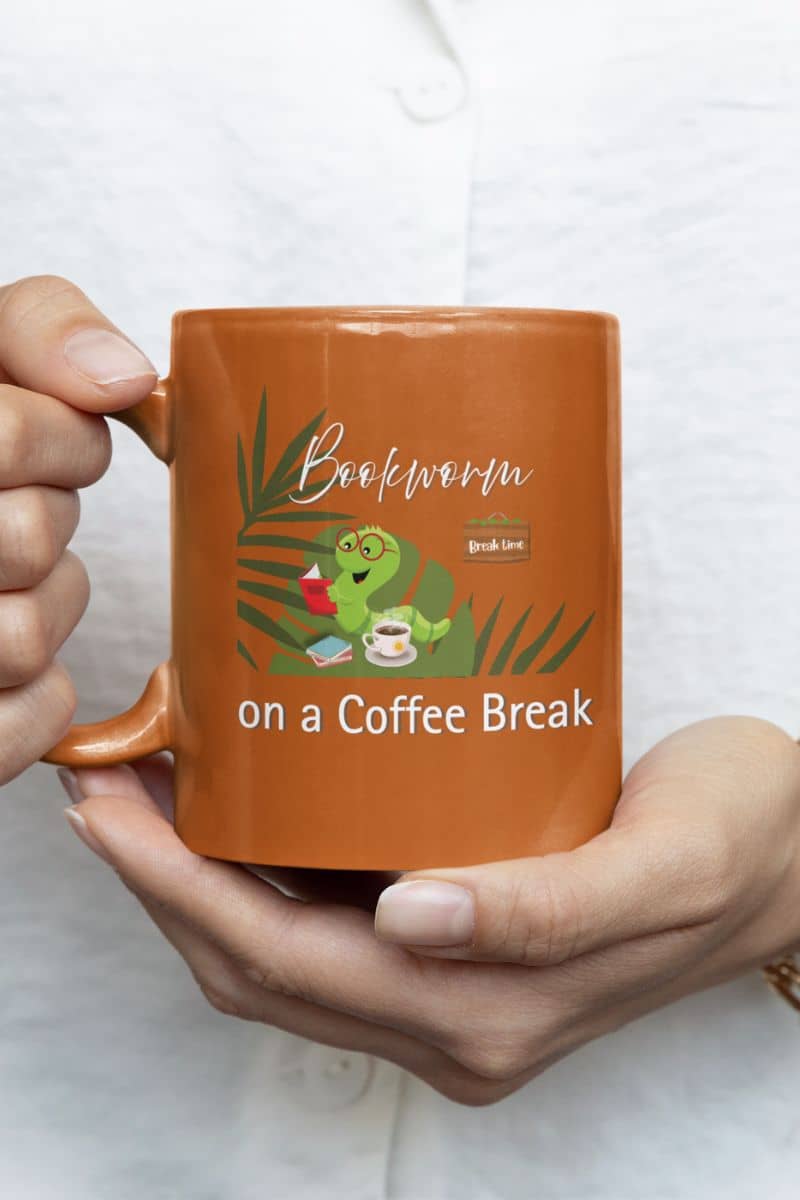 Coffee mug for readers with a woman holding an orange cup in front of her chest
