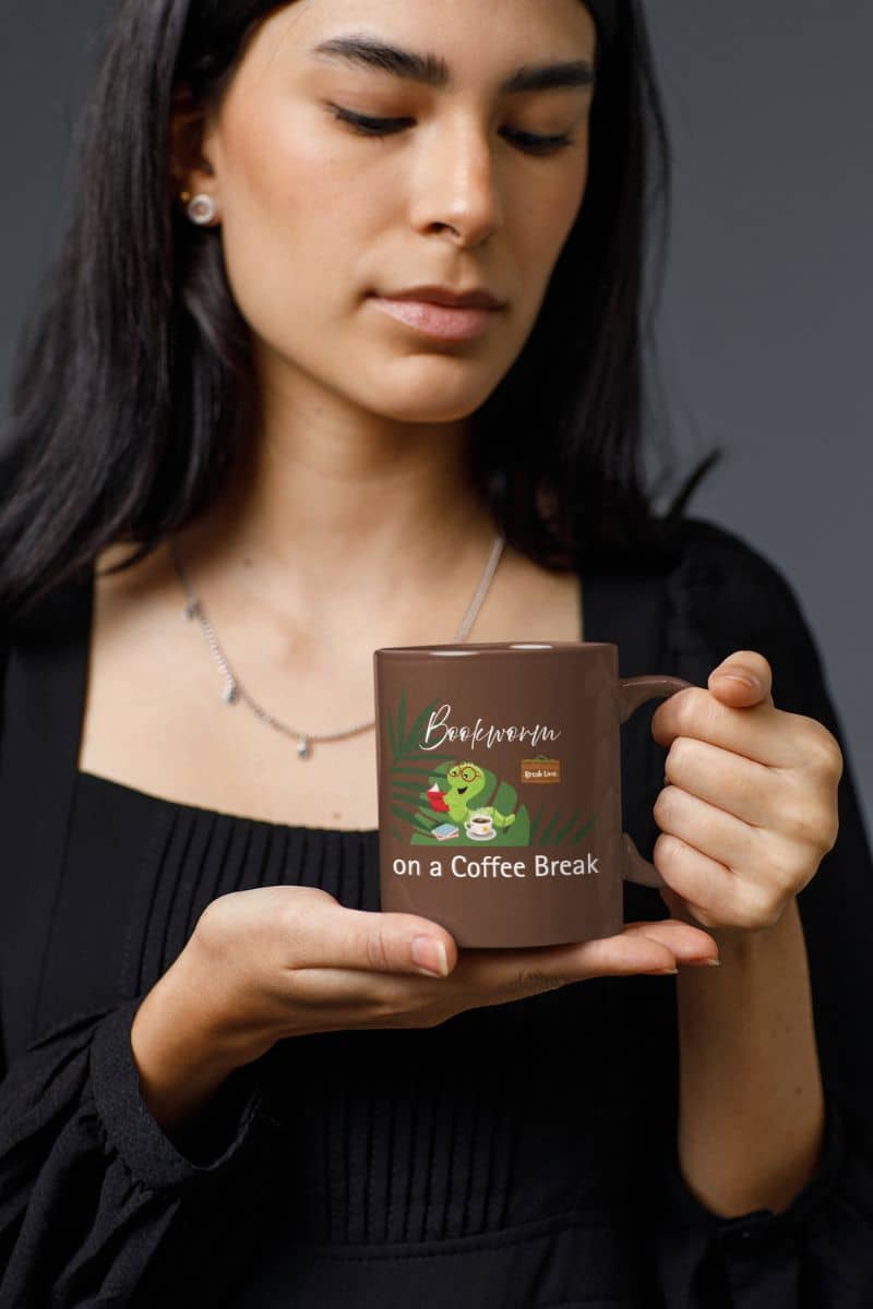Coffee mug for readers with a woman looking at the cup in her hand