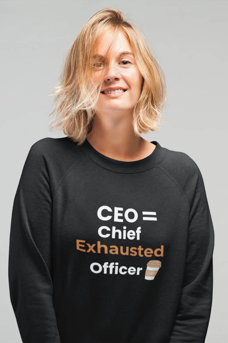 Coffee quote sweatshirt with a person wearing a black sweatshirt with text 'CEO = Chief Exhausted Officer' on a gray background