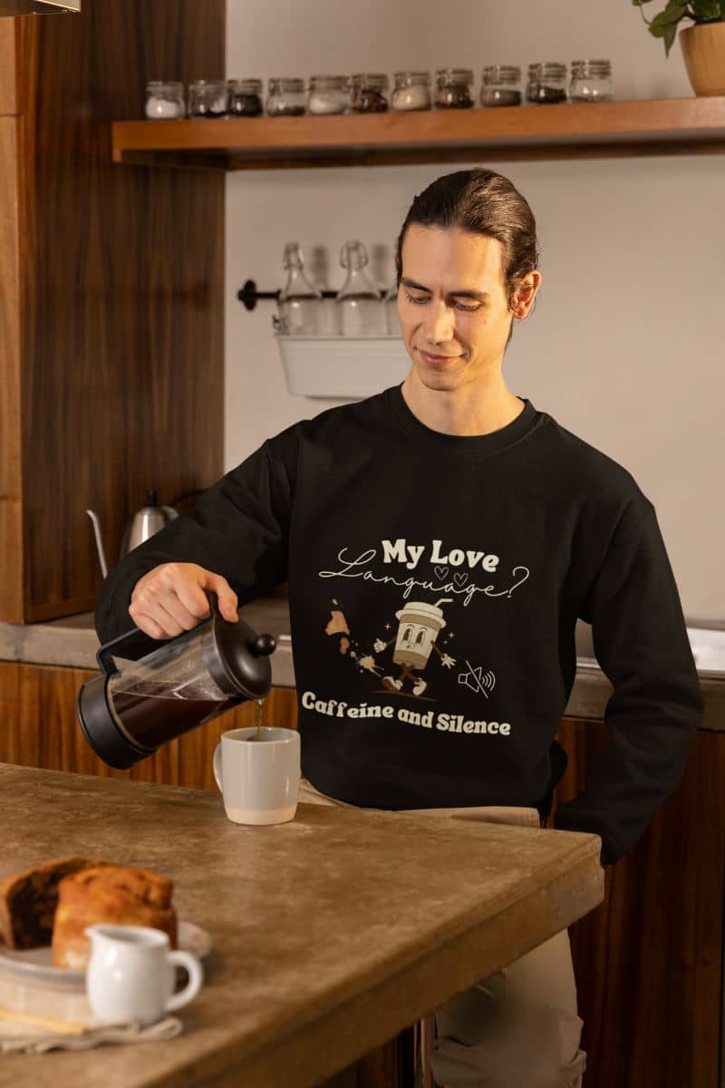 Comfy coffee sweatshirt with a man pouring coffee into a cup