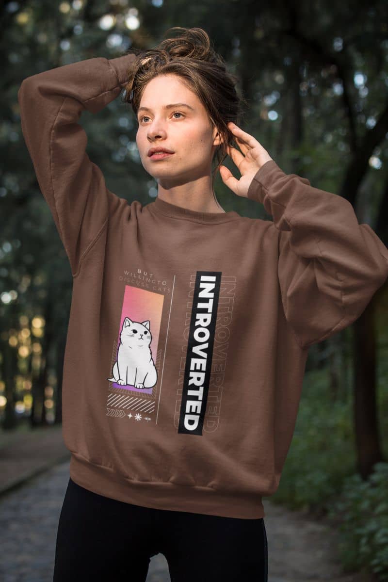 Comfy introverted sweatshirt with a girl posing with her hair in the park