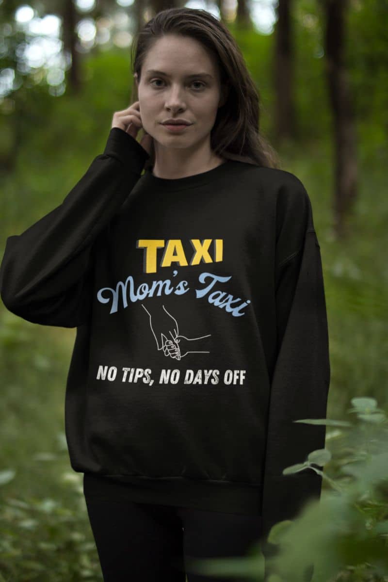 Comfy mom's taxi sweatshirt with a girl posing in the woods