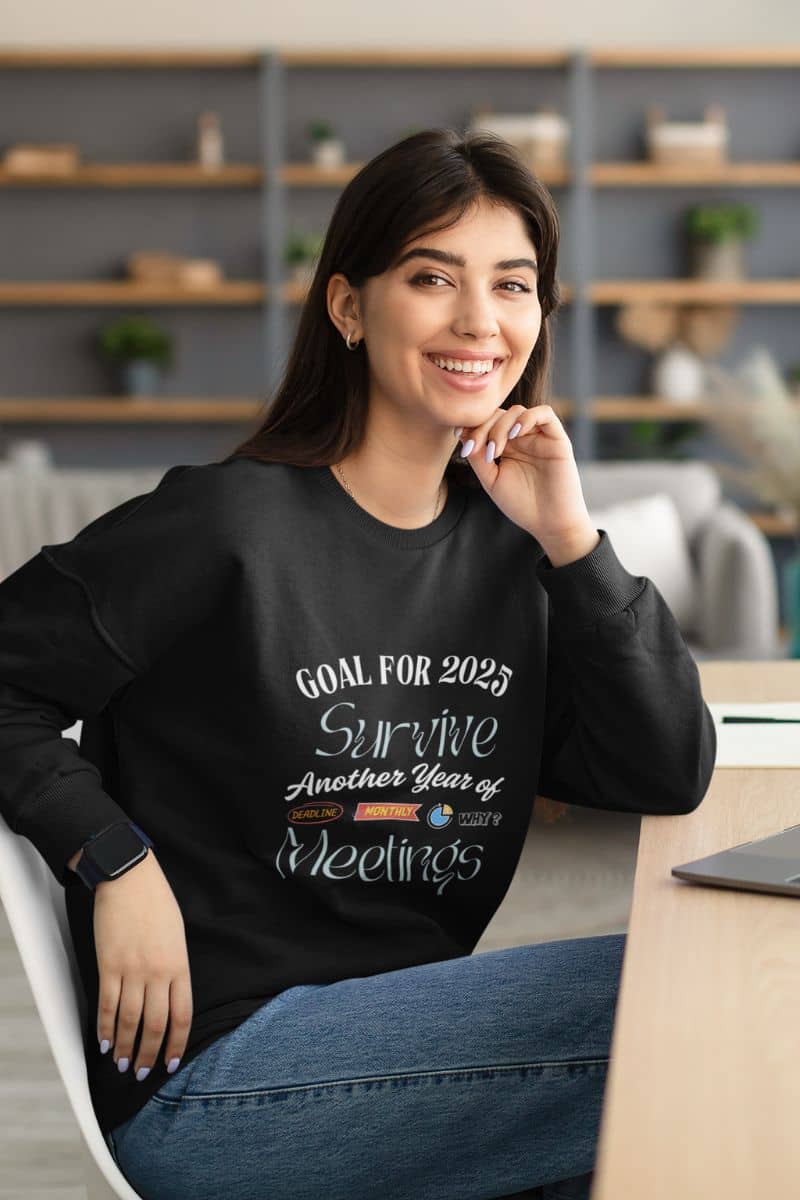 Comfy work sweatshirt with a girl sitting working with a bright smile