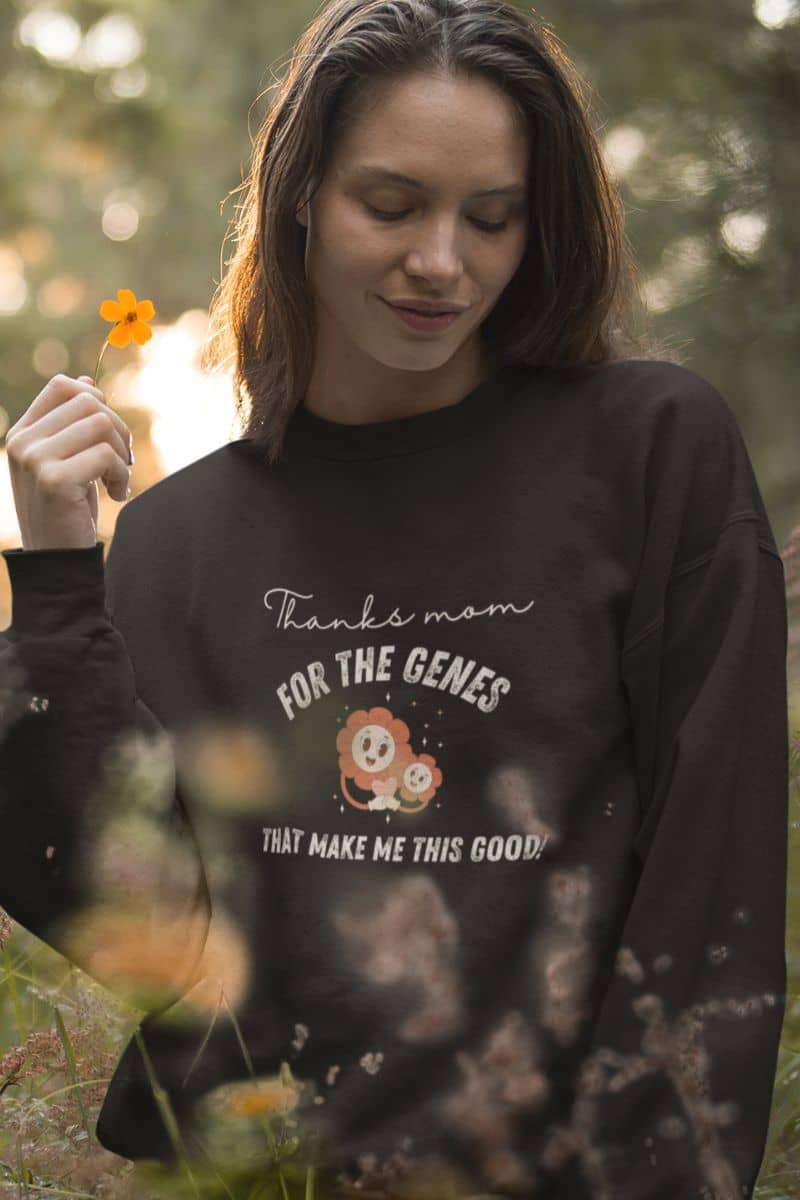 Cool sweatshirt with a beautiful girl posing in the flower garden