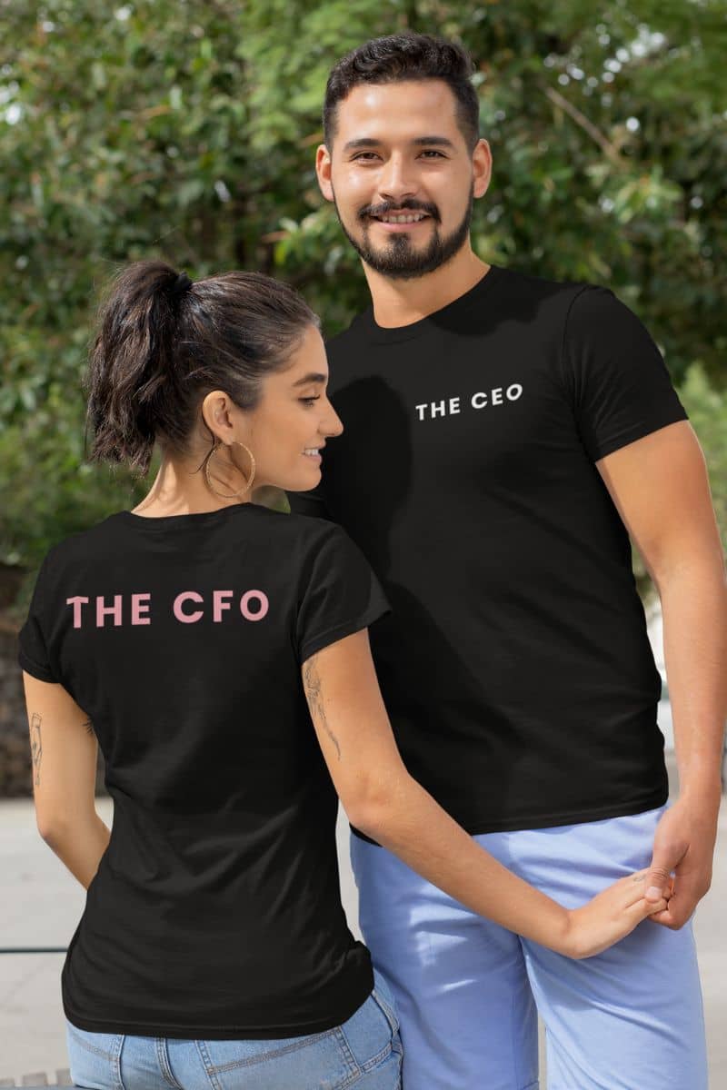 A couple poses in black tees, one featuring “THE CEO” on the front and the other “THE CFO” on the back – a simple yet bold Couple T-Shirt design that makes a statement.