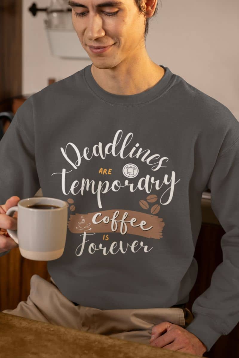 Cozy coffee enthusiast sweatshirt with a man looking into his coffee cup