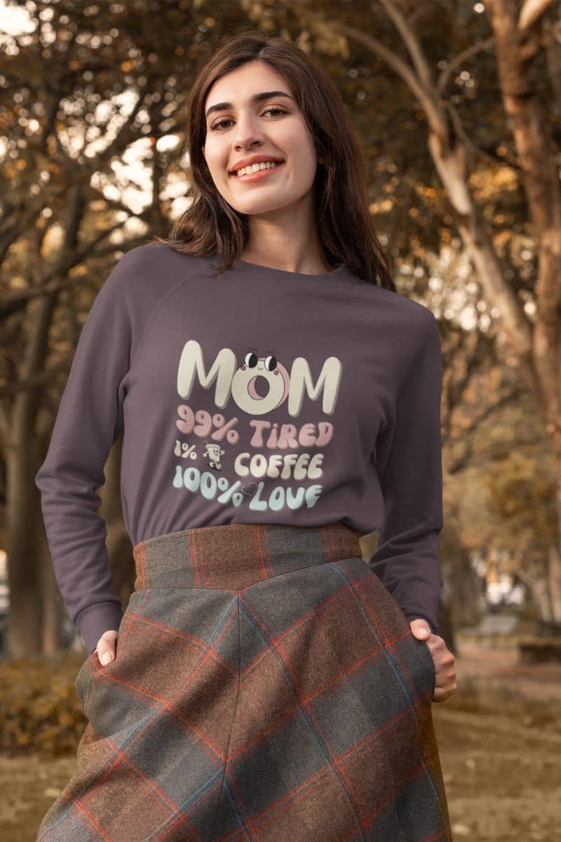 Cozy mom sweatshirt with a woman standing posing under a tree in the park