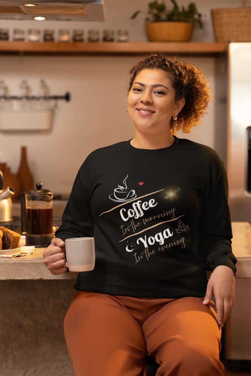 Cozy pullover sweatshirt with a woman holding a cup of coffee in the kitchen