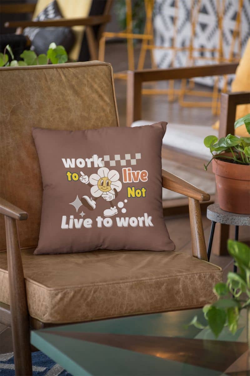 Decorative quote pillow with a square pillow placed on the sofa