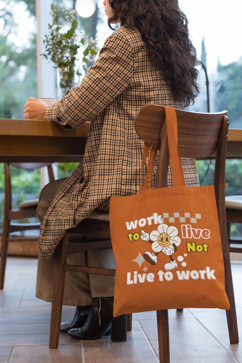 Eco-friendly tote bag with a girl who was folding her tote bag on the chair while drinking coffee