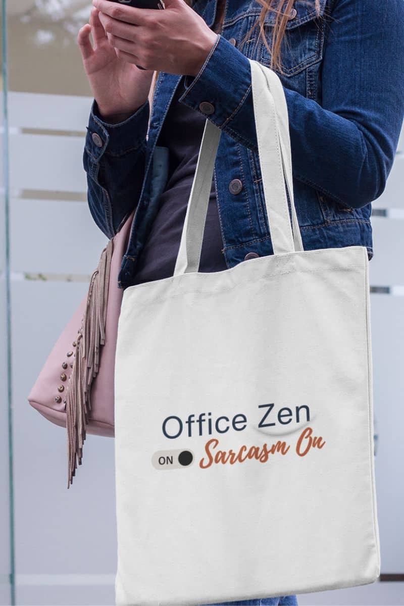Eco-friendly tote with a person holding a tote bag with 'Office Zen' text, wearing a denim jacket.