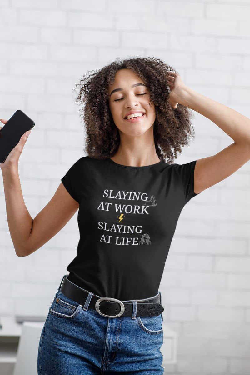 Empowered woman tee with a girl dancing to music at home