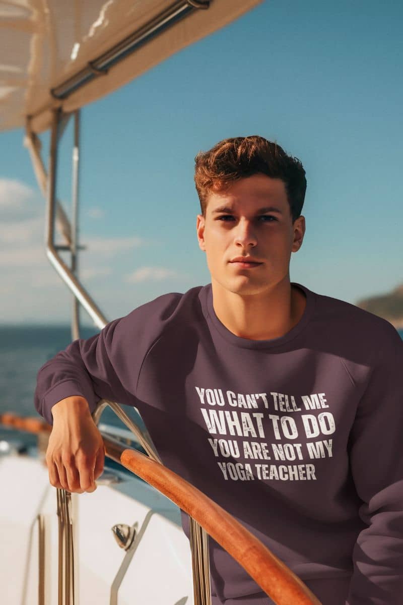 Empowering yoga  sweatshirt with a guy sitting on the side of a boat while traveling