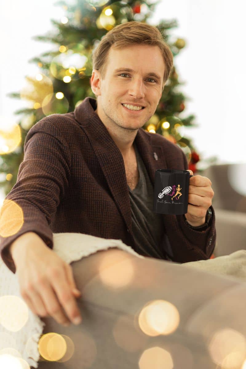 Fuel your passion coffee mug with a guy smiling brightly on the sofa while holding a cup of coffee on Christmas day