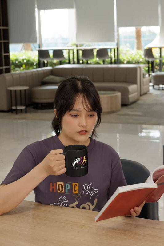 Fuel your passion coffee mug with a girl reading a book while holding a cup of coffee in her hand