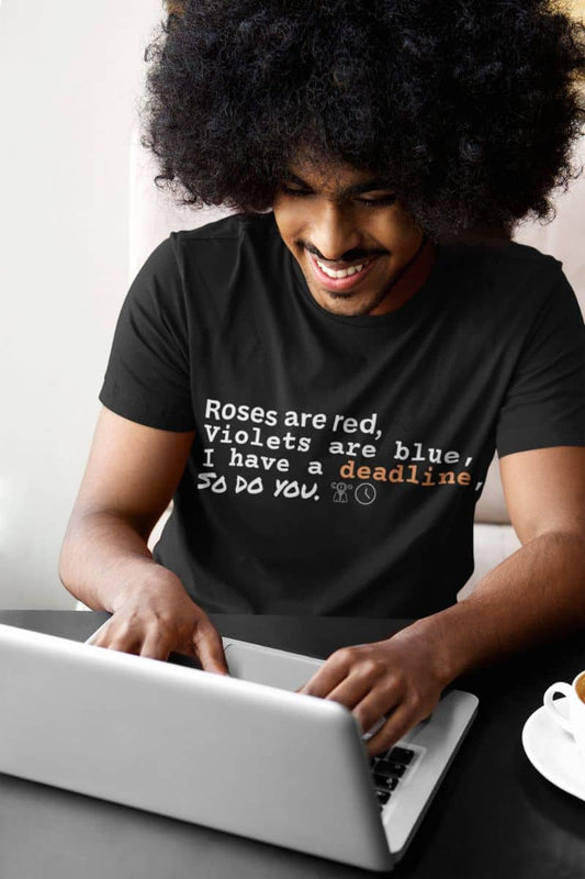 Funny deadline t-shirt  with a curly haired guy sitting working on a laptop