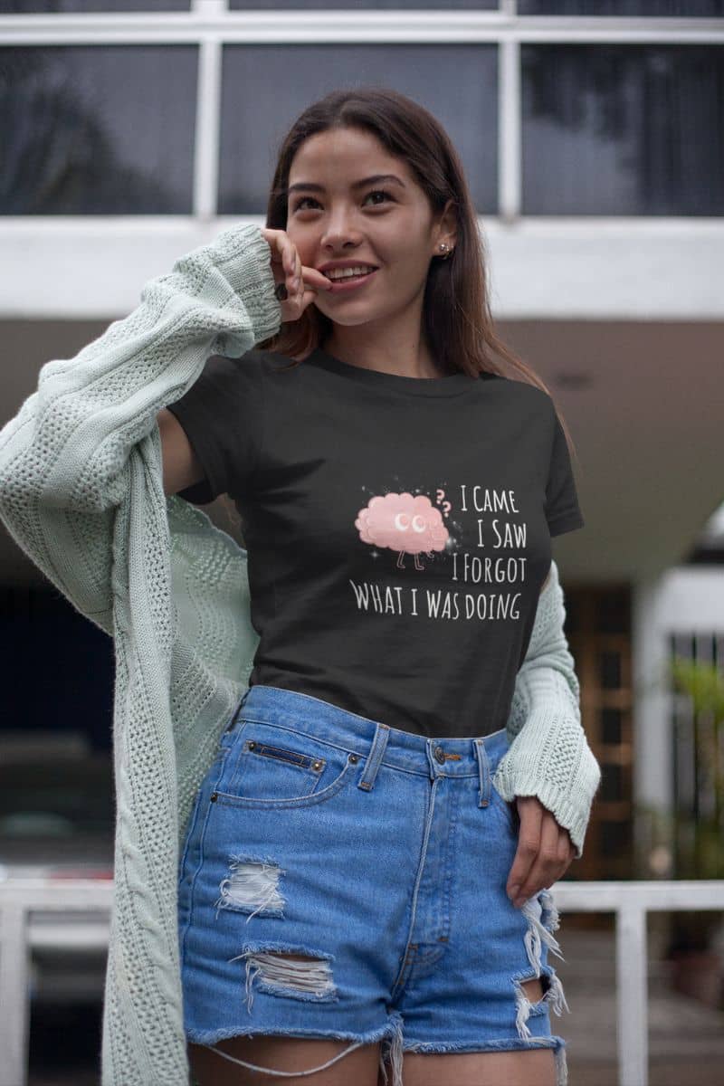 Funny graphic t-shirt with a girl standing posing in a sweater