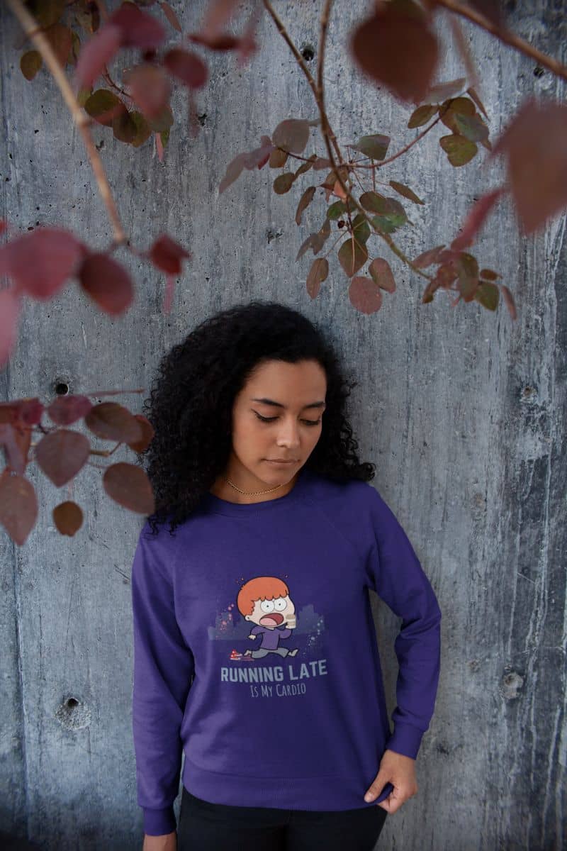 Funny running sweatshirt with a beautiful girl posing against the wall next to a red leaf tree