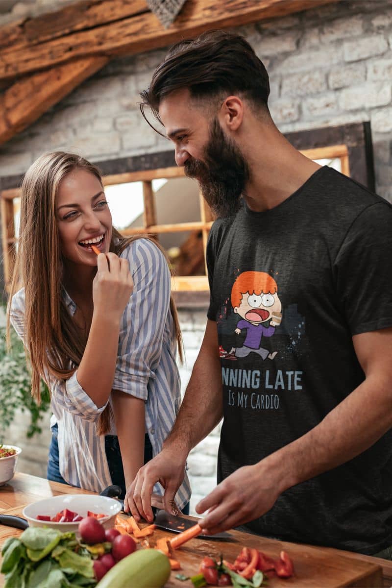 Funny running t-shirt with a couple preparing a salad while chatting happily in the kitchen