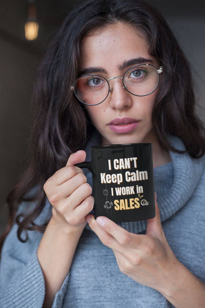Funny sales coffee mug with the girl wearing glasses holding a cup to her chest