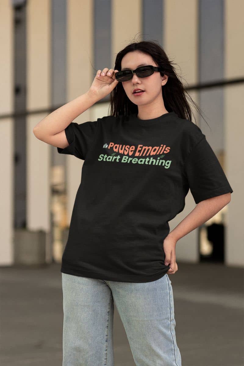 Funny self-care graphic tee with a person wearing a black t-shirt with colorful text, standing outdoors.
